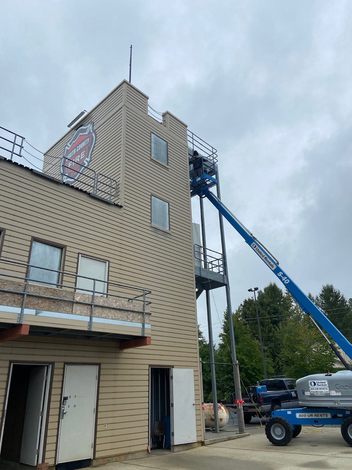 Large commercial welding job from a boom lift on a fire-training tower